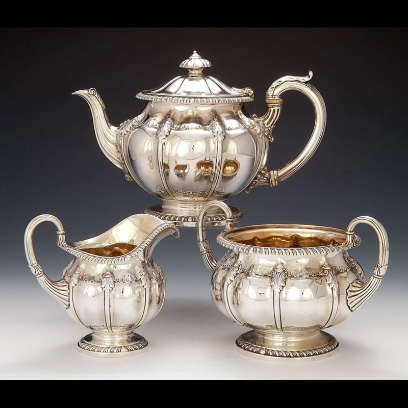 A George IV silver three piece tea service by Paul Storr, London 1822 and 1823