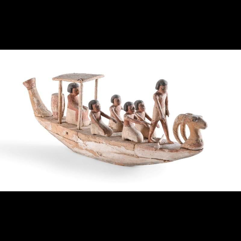 An Egyptian Wood Funerary Boat With Crew, Middle Kingdom, Circa 2133-1979 B.C.