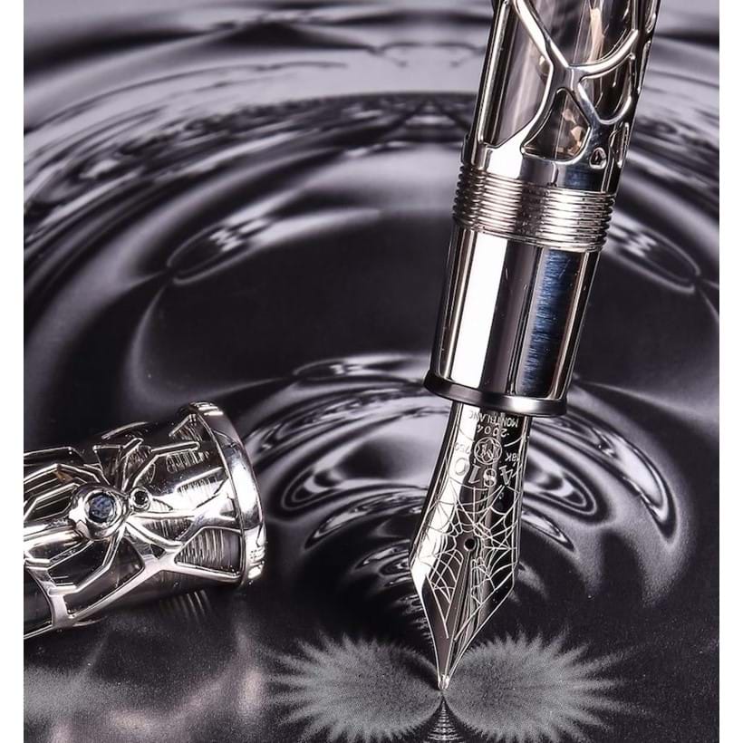 Inline Image - Magical Black Widow, 88, limited edition white gold coloured skeleton fountain pen, no. 09/88, circa 2004, stamped 750, the cap with a spider clip set with two black diamonds and a mother of pearl emblem, the medium nib stamped 18K 750, piston filling system, uninked, est. £8,000-12,000
