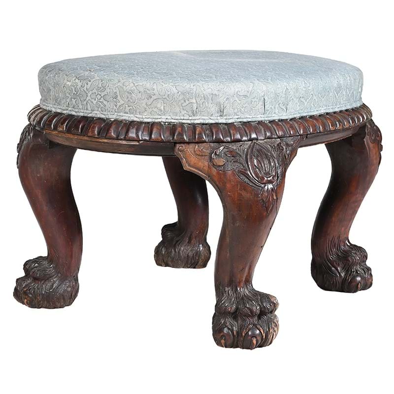 A large Anglo-Indian carved hardwood and upholstered stool, mid 19th century