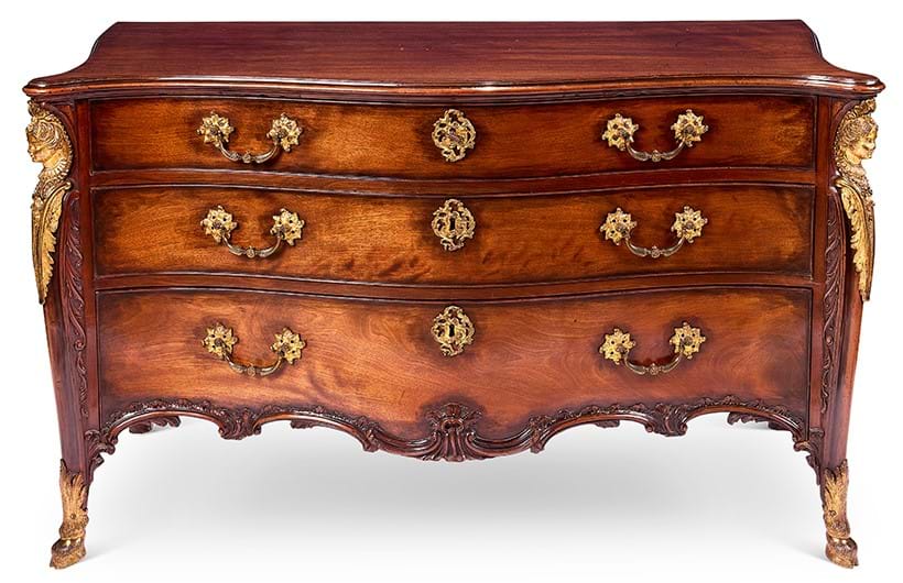 Inline Image - Lot 97: A George III ormolu-mounted mahogany serpentine commode, attributed to John Cobb, mid 18th century | Sold for £75,200