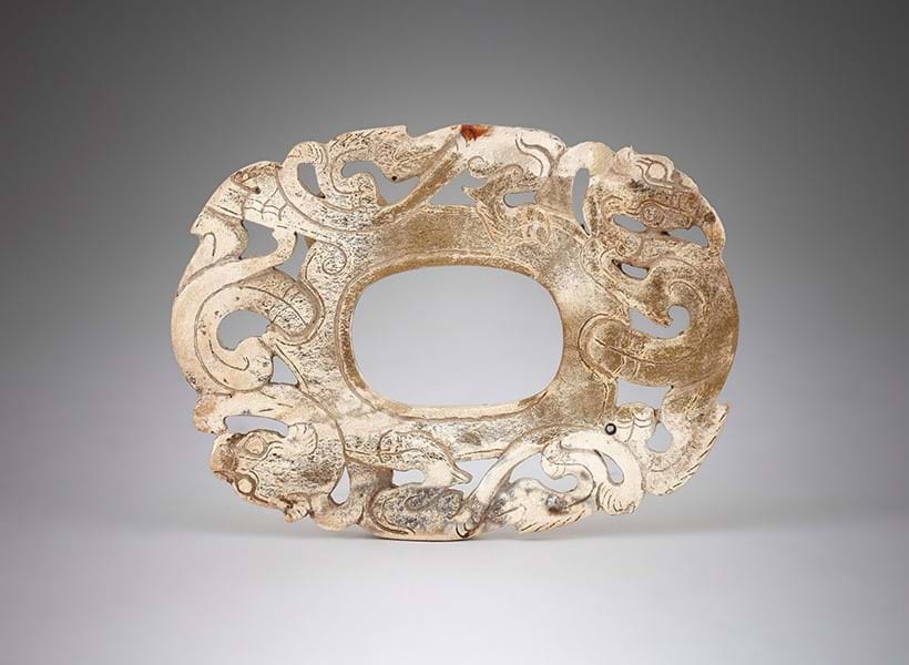 Inline Image - Lot 400: A Chinese calcified 'Chicken Bone' jade plaque, Warring States-Han Period (475 BC-220 AD) | Sold for £47,700