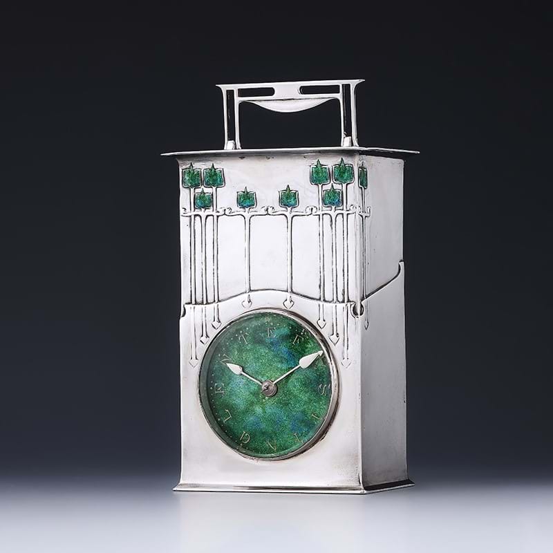 A Silver and Enamel 'Magnus' Cymric Clock, designed by Archibald Knox
