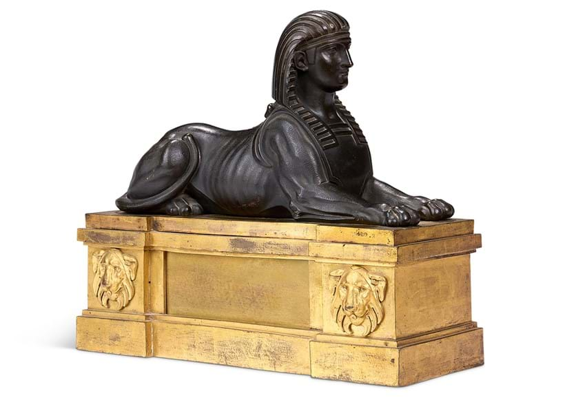 Inline Image - Lot 433: A bronze model of a sphinx on ormolu base, French, 19th century and later | Est. £700-1,000 (+ fees)