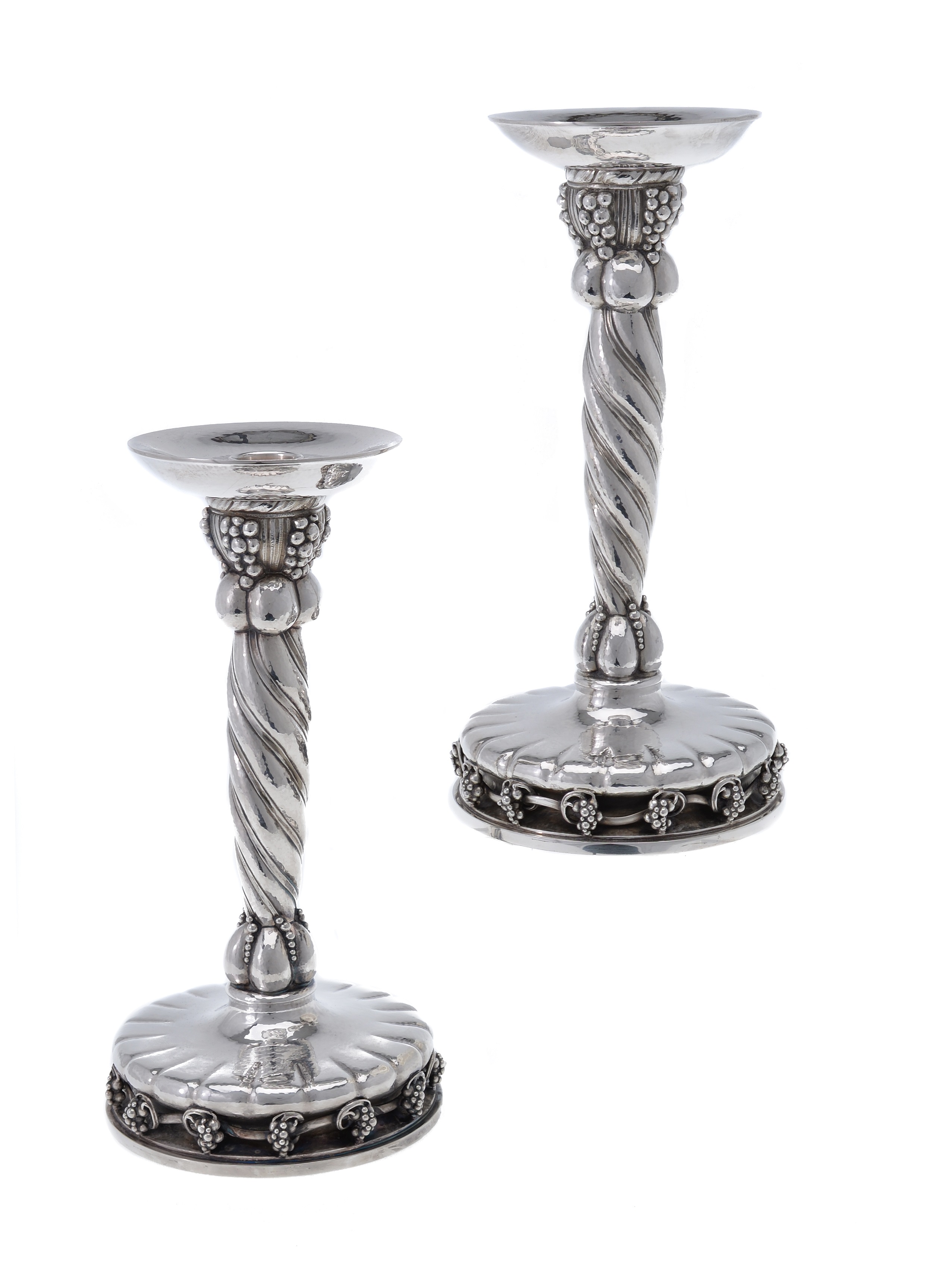 Georg Jensen, a pair of Danish silver grape pattern large candlesticks, post 1945, designed by Georg Jensen 
