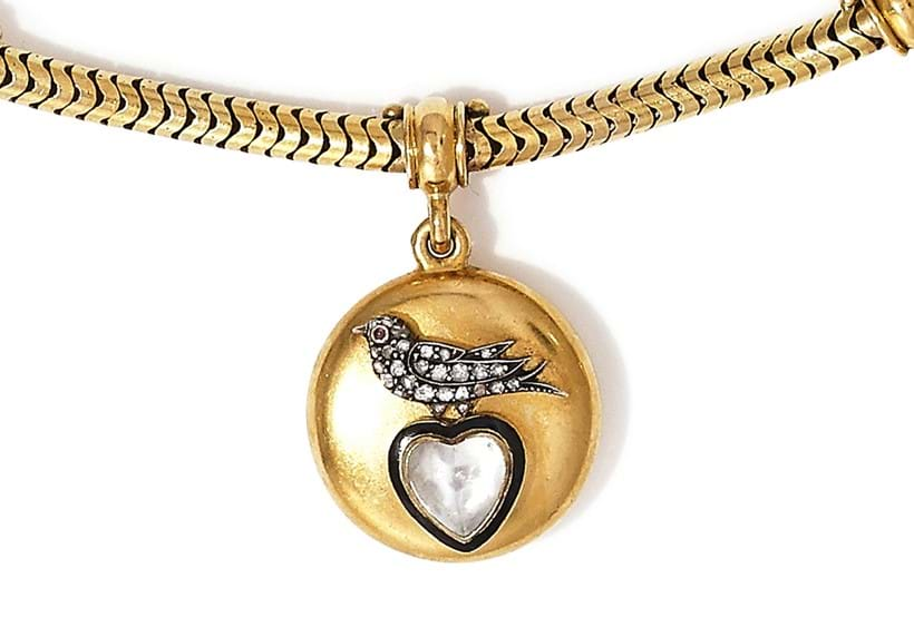 Inline Image - The moonstone heart is surrounded by black enamel to signify mourning.