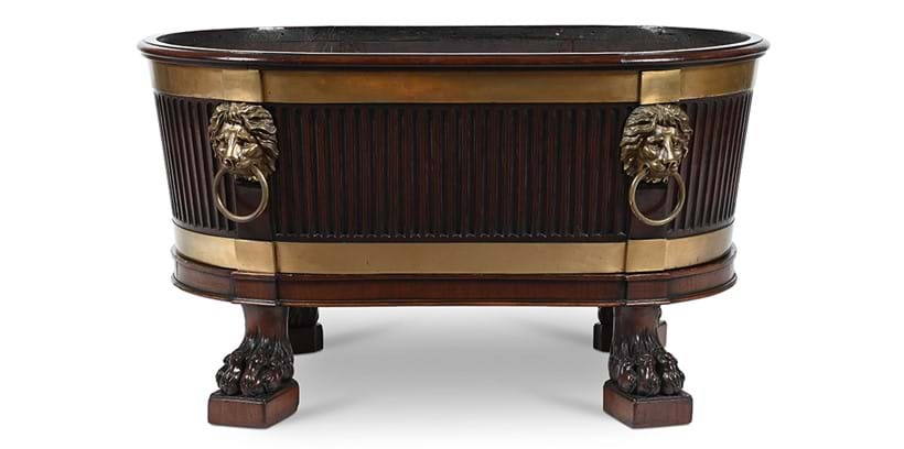 Inline Image - Lot 166: A George III mahogany and brass mounted wine cooler, after a design by Robert Adam, circa 1780 | Est. £10,000-20,00 (+ fees)