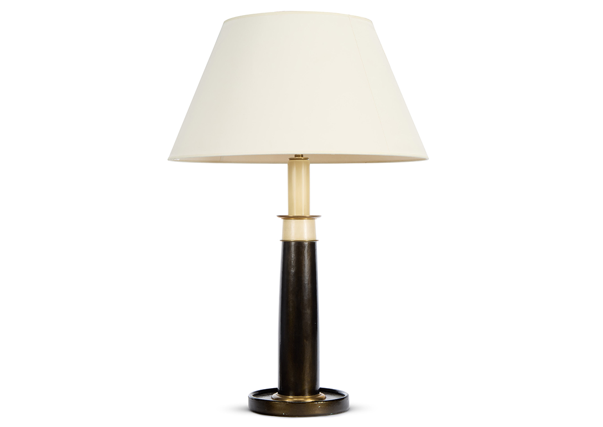 Sibyl Colefax & John Fowler auction - Lot 66 - a brass mounted and bronzed leather lamp.jpg