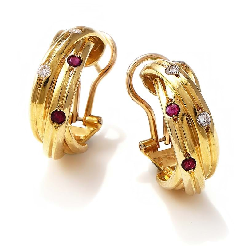 Inline Image - Cartier, a pair of gem set 'trinity' earrings designed as three interlocking reeded 18ct gold bands | Sold for £3,024