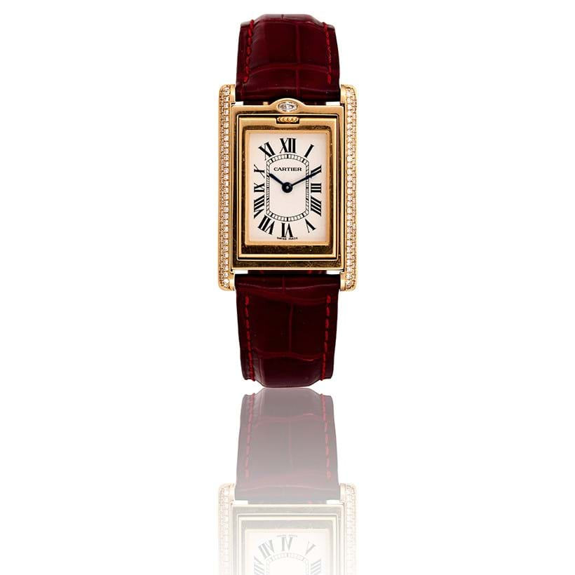 Inline Image - Cartier, Tank Basculante, a lady's 18 carat gold and diamond reversible wrist watch, circa 2003 | Sold for £13,860