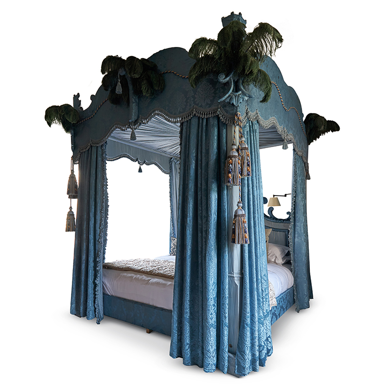 A blue damask and blue ostrich feather four poster bed modern, designed by Robert Couturier