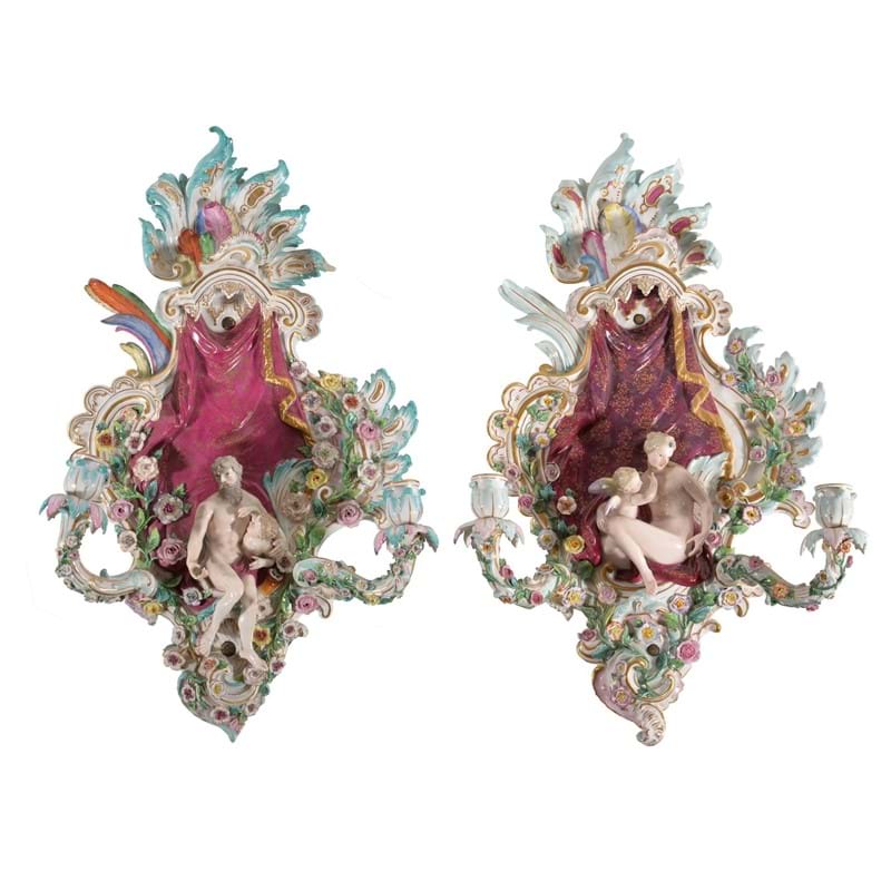 A pair of Meissen flower-encrusted allegorical two-branch wall appliques, late 19th century 