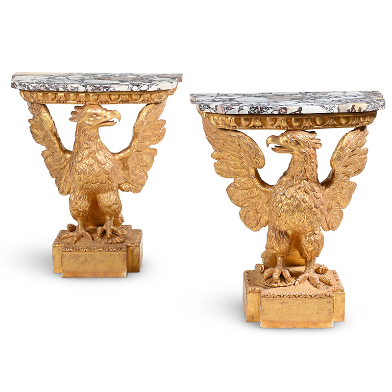 A fine pair of George II giltwood and breche violette marble console tables in the manner of William Kent, circa 1735-1740