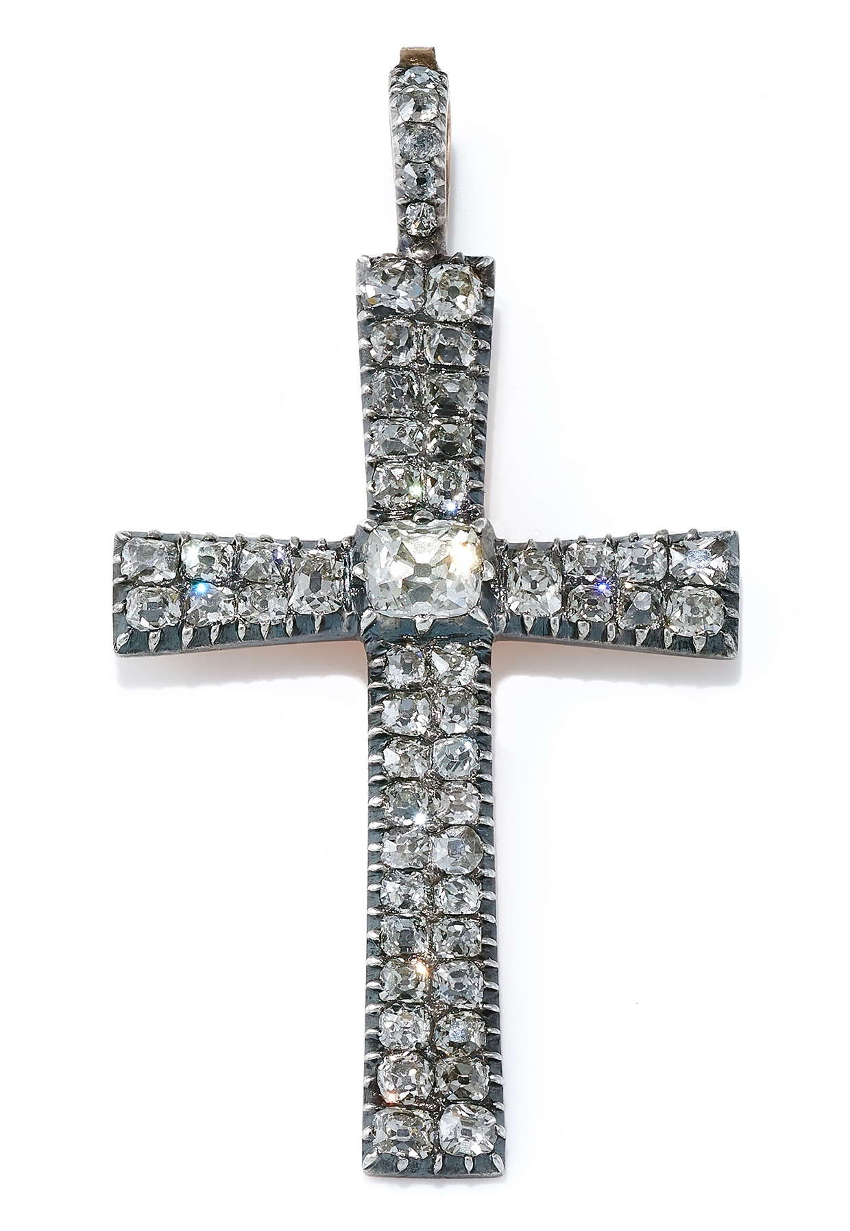 A Georgian diamond cross pendant, circa 1800, the central old cushion shaped diamond between slightly tapered arms set with twin rows of old mine cut diamonds.jpg