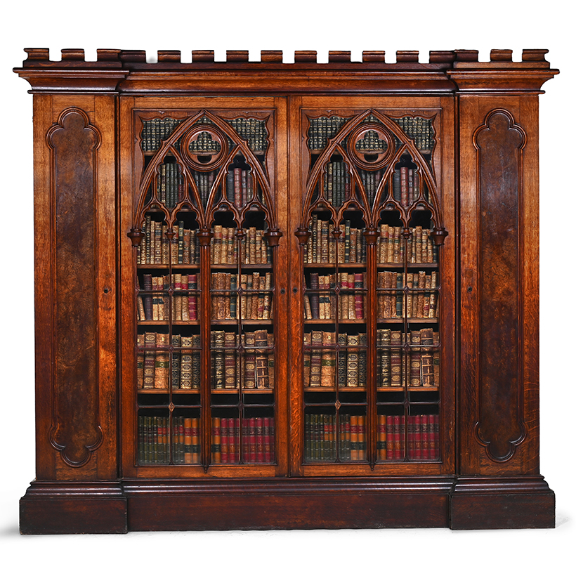 A Victorian gothic revival oak and pollard oak inverted breakfront bookcase cabinet circa 1880