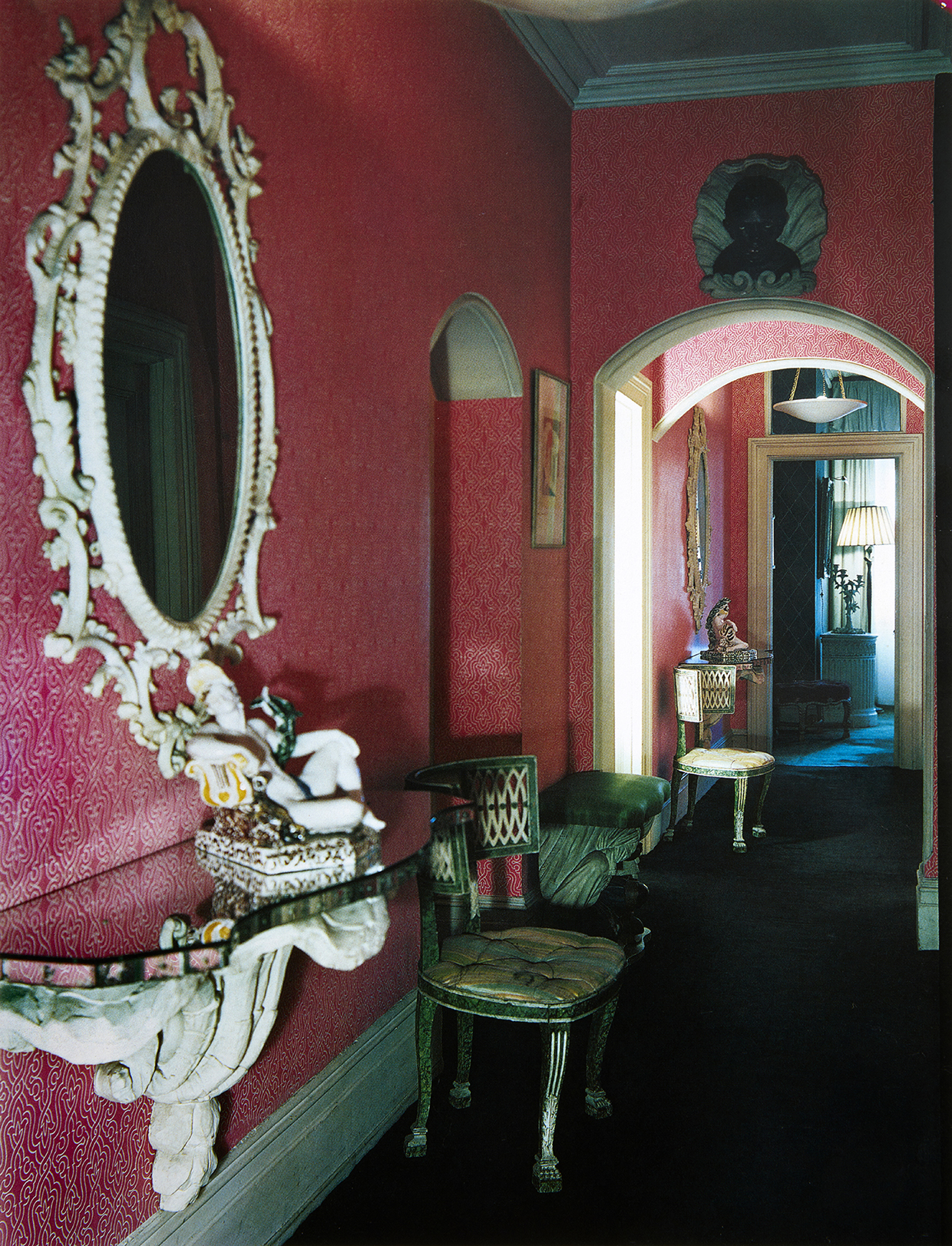 Park Lane entrance hall, treated in a Pseudo-Classical mode. The deep rose wallpaper was colour-matched to an Indian sari. Anthony Denney House and Garden, © Condé Nast Publications Ltd..jpg