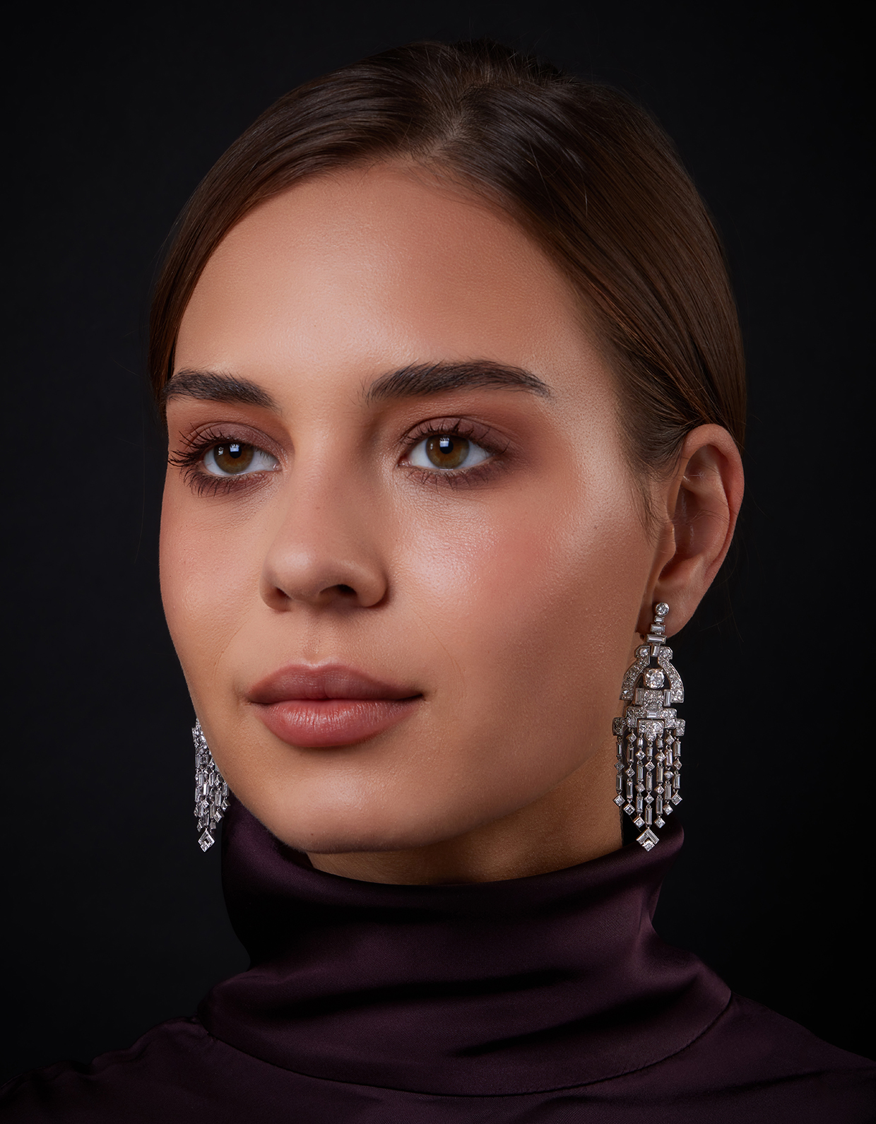 Lot 229 - Cartier, a pair of Art Deco diamond earrings model shot.jpg