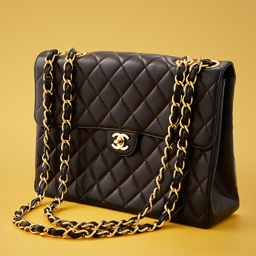 14810 Lot 306 Chanel, classic flap, a black lambskin handbag Sold for £2,794.jpg