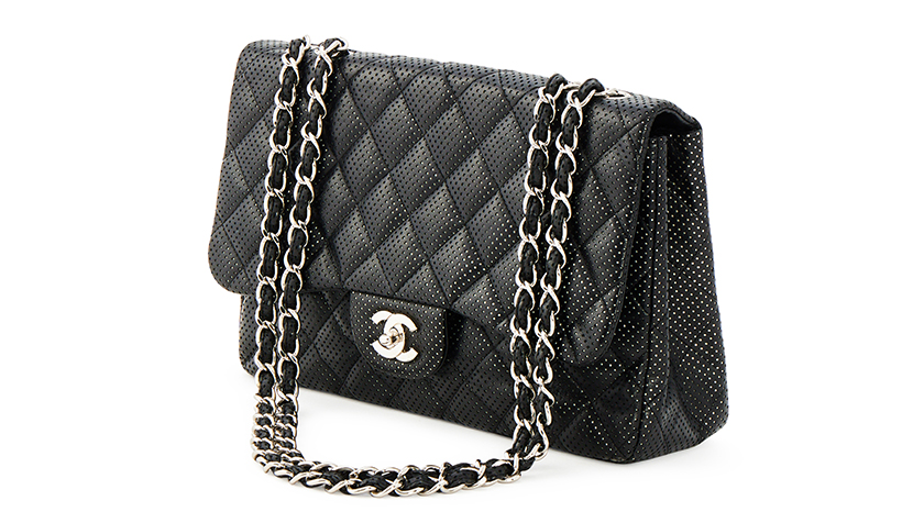 14810 Lot 314 Chanel, classic flap a black perforated lambskin handbag Sold for £2,540.jpg