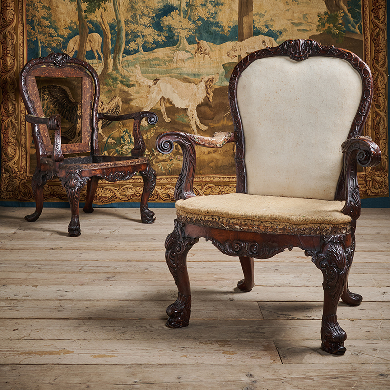 A pair of George II carved mahogany armchairs, after designs by William Kent and John Vardy, circa 1740