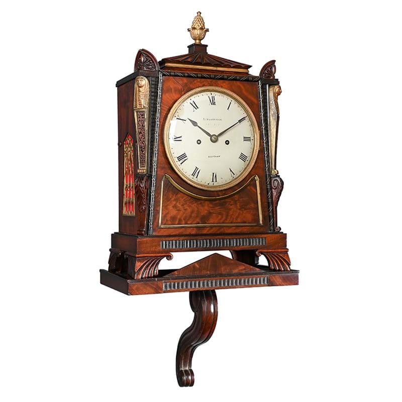 A Regency brass mounted mahogany bracket clock in the manner of Thomas Hope with wall bracket, London, circa 1825