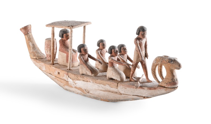 An Egyptian Wood Funerary Boat With Crew, Middle Kingdom, Circa 2133-1979 B.C.