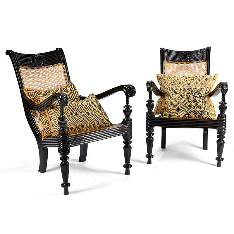 A pair of Ceylonese ebony and caned armchairs, 19th century