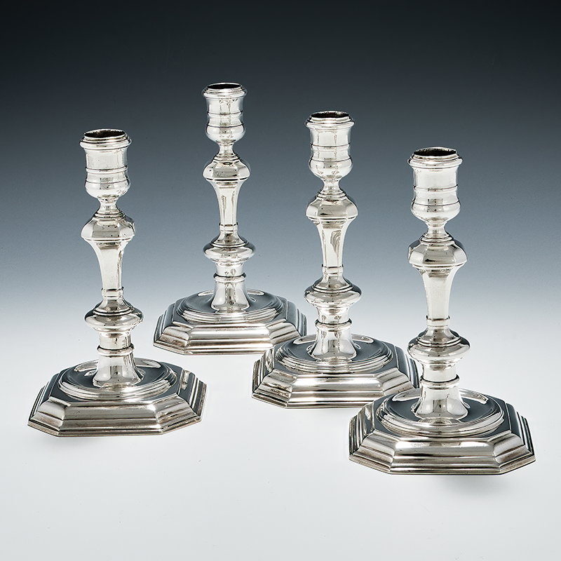 A set of four George I cast silver candlesticks, Samuel Margas, London 1724
