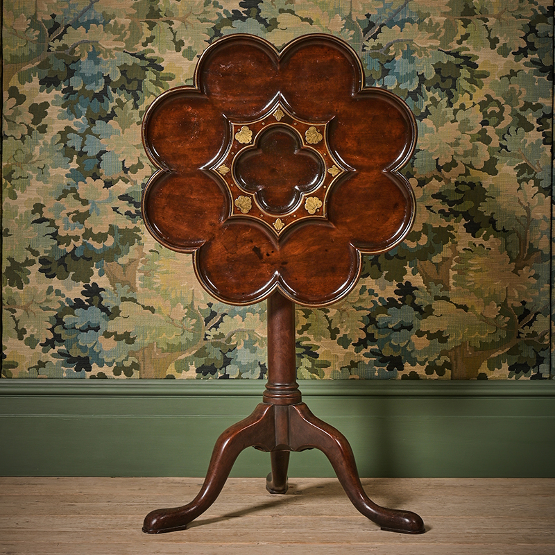 A George II mahogany and brass marquetry tripod table, attributed to Frederick Hintz, circa 1740