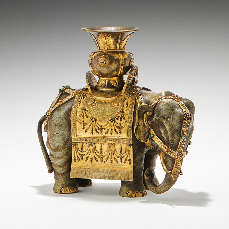 Y A fine Chinese Imperial bronze caparisoned 'elephant and vase', Qianlong Period (1736-1795)